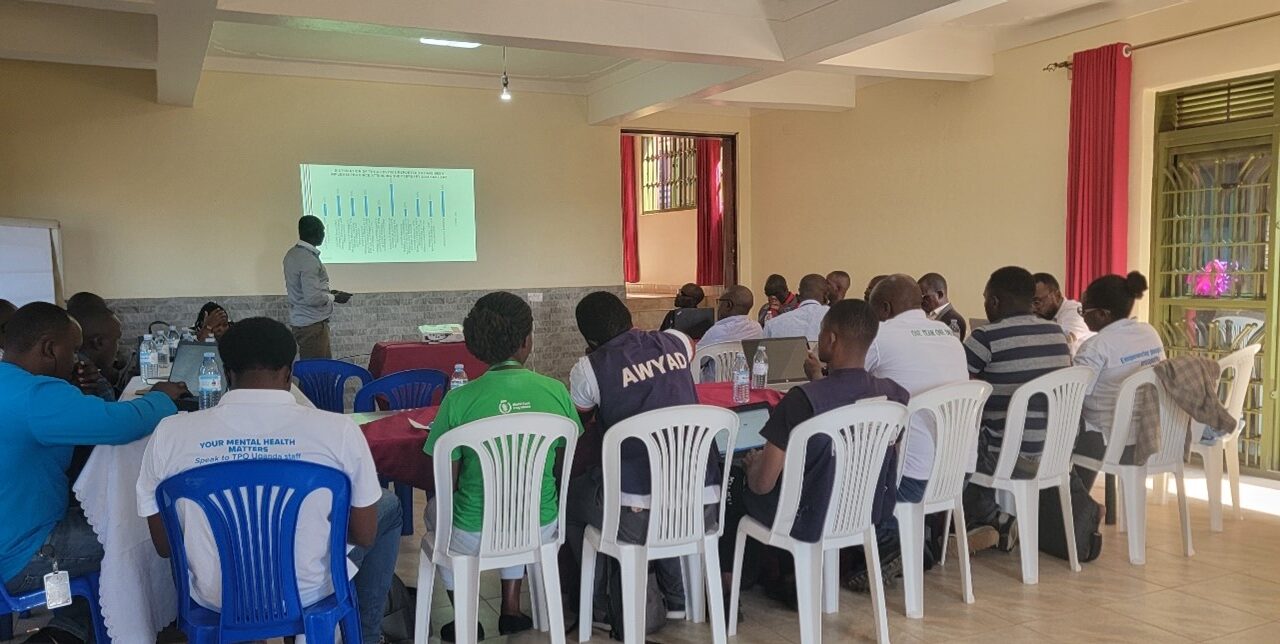 One of the workshop participant makes a presentation during the Lessons Learned workshop at Kyaka Motel, Kyegegwa district.